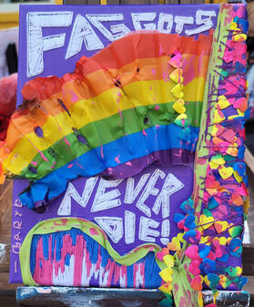 "Faggots Never Die!". Mixed media (acrylic paint, embroidery, various sewn objects). 2024.